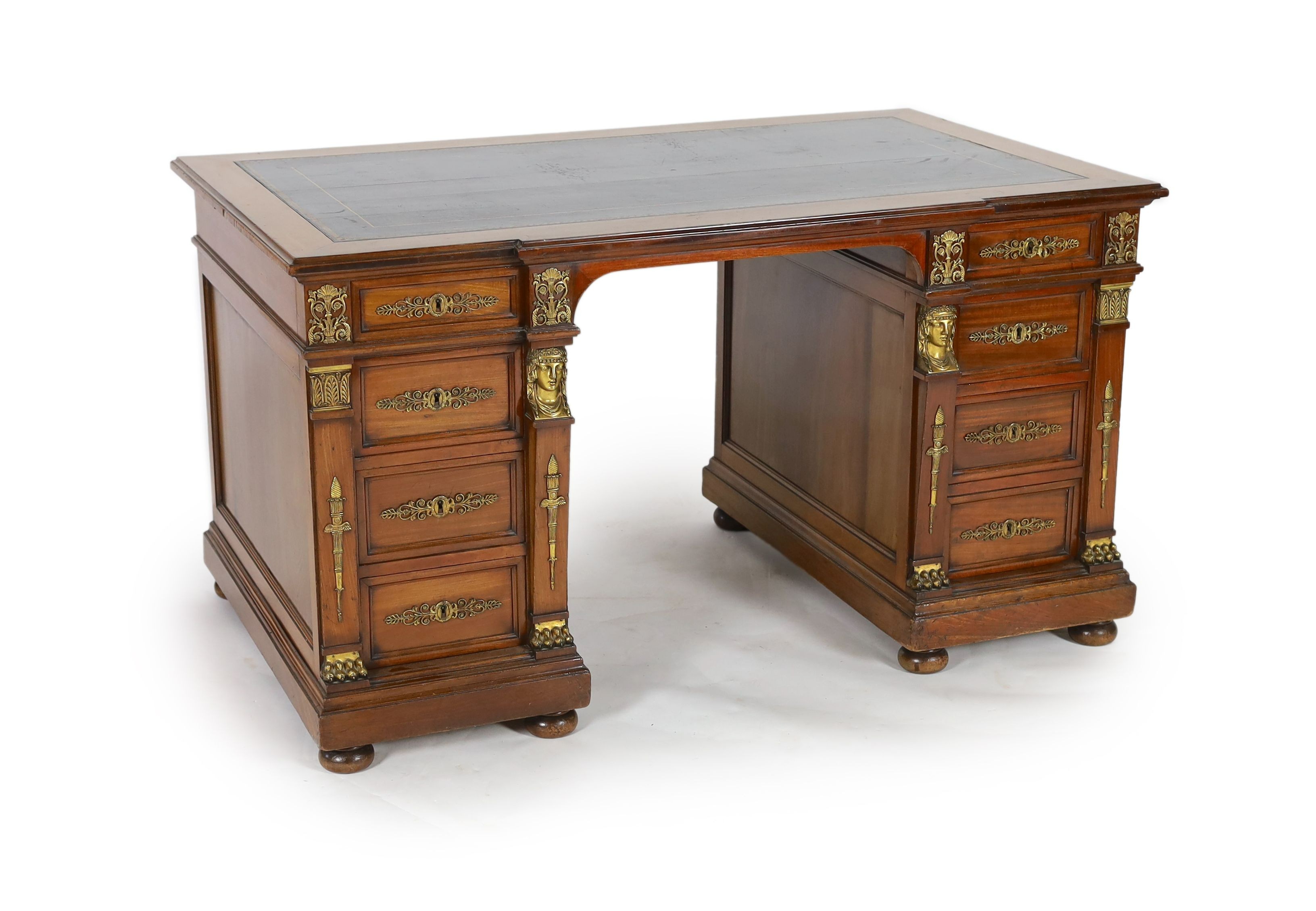 An early 20th century French classical revival mahogany breakfront pedestal desk, W.135cm D.82cm H.75cm